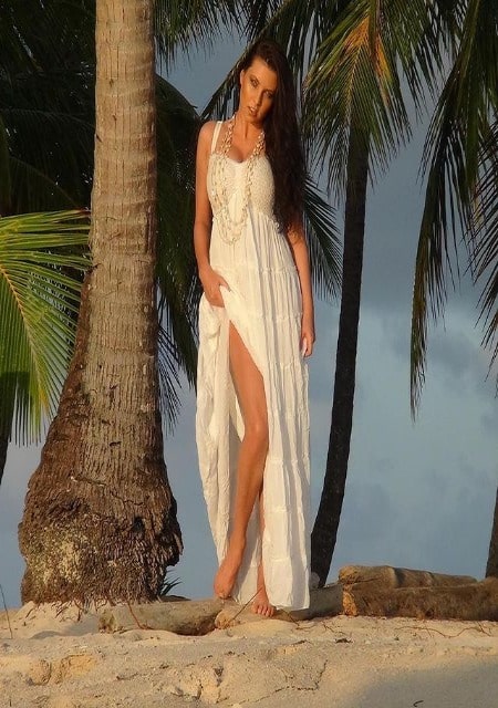 Ewa Sonnet is looking bold and beautiful in the white one piece dress. Is Sonnet married as of 2021?